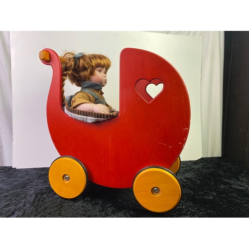 224 - Wooden toy pram with Leonardo collection doll