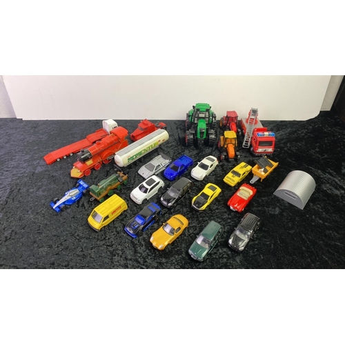 234 - A box of model trucks, trains and tractors