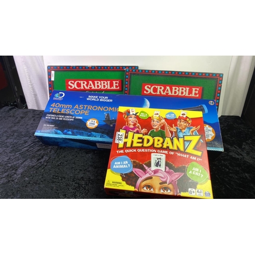 238 - Iced 40mm astronomical telescope, two scrabble sets and a Hedbanz game