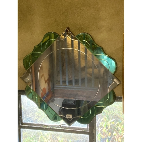 409 - Art Deco style decorative mirror. Measures approx 64cm square