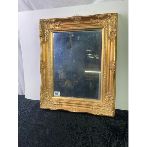 410 - Mirror in an impressive gilt frame approx 52cm x 44cm