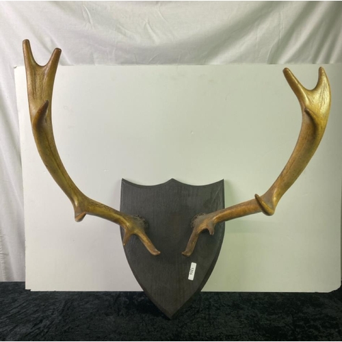 414 - A pair of mounted antlers mount measures approx 34cm x 27cm