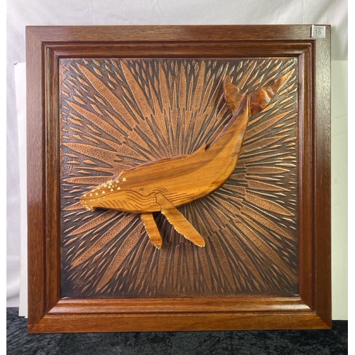 416 - A carved whale framed and mounted with copper backing. Frame approx 67cm square