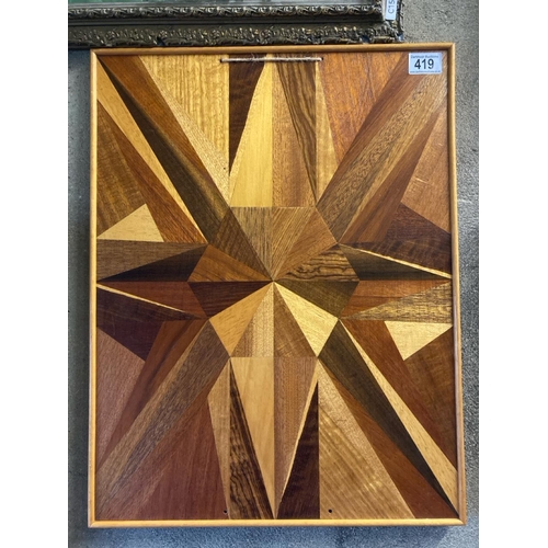 419 - A wooden marquetry panel with geometric design - could be used as a tray. Measures approx 55cm x 43c... 