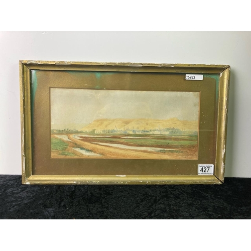 427 - A framed watercolour of a Eastern town scene indistinctly signed dated 1945. Frame A/F and approx 46... 