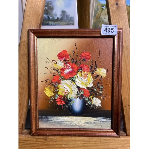 495 - Oil on board of a still life vase of flowers, unsigned. Approx 27cm x 33cm