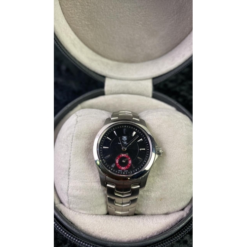 544 - A Tag Heuer ladies Link Tiger Woods watch limited edition with black face, boxed with original paper... 