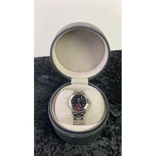 544 - A Tag Heuer ladies Link Tiger Woods watch limited edition with black face, boxed with original paper... 