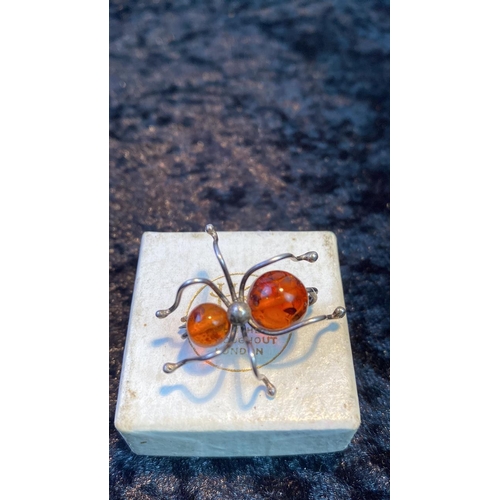 548 - Silver and amber spider brooch