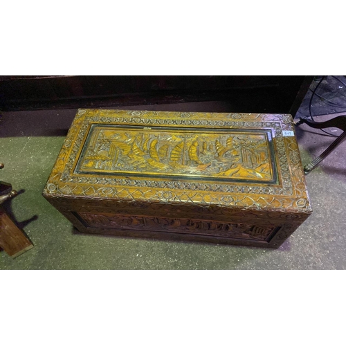 641 - Camphor wood lidded chest with ornate carved detail including ships, approx D43cm x W87cm x H35cm