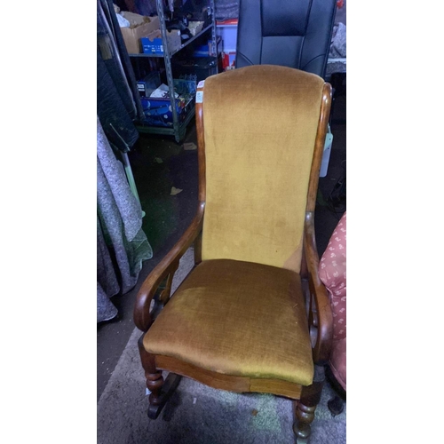 651 - Mustard yellow upholstered low rocking chair, approx W54cm x H102cm