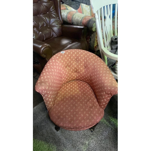 652 - Pretty upholstered tub chair on casters with rose design, approx W62 x D80 x H68cm