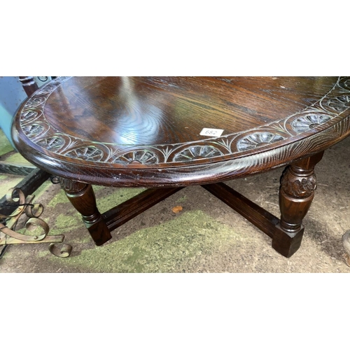 682 - A large circular coffee table, solid hardwood construction, with decorative scallop edging. Approx H... 