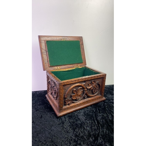 71 - Carved wooden box with 1892 and initials carved into lid and grapevine design. Approx 17cm x 28cm x ... 