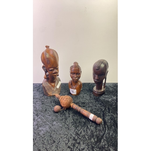 76 - Three carved wooden figure heads along with a carved prayer wheel (possibly Tibetan)