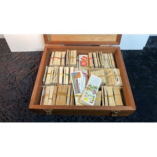 770 - Wooden box containing a quantity of cigarette cards (listed in additional photo)