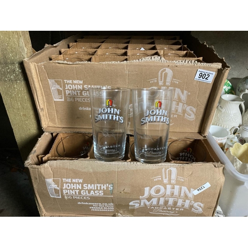 902 - Collection of beer glasses, 2 boxes of 24. John Smith’s