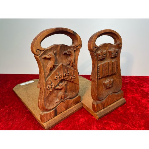 310a - Pair hand carved oak bookends with crests of Oxford University and Trinity College