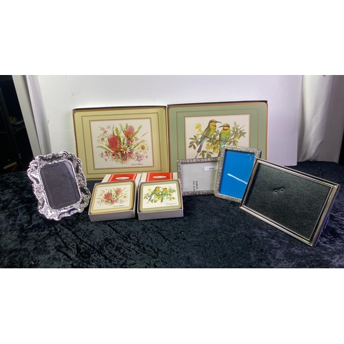 1059 - Two boxed sets of Pimpernel place mats and coasters of world flowers and birds and a selection of pi... 