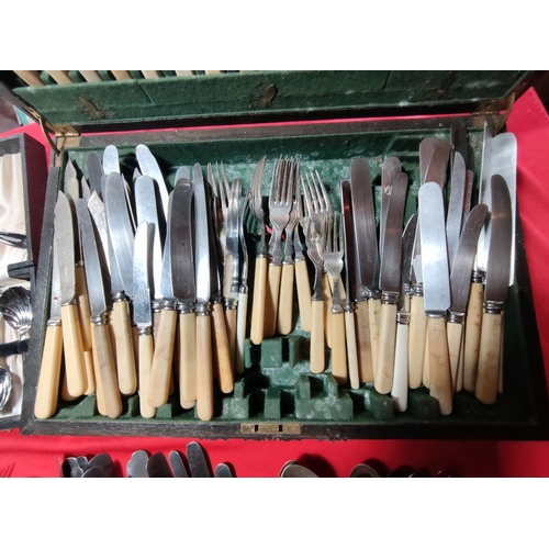 1104 - Veritable feast of cutlery to pick the bones out of including 2 wooden cutlery canteens.