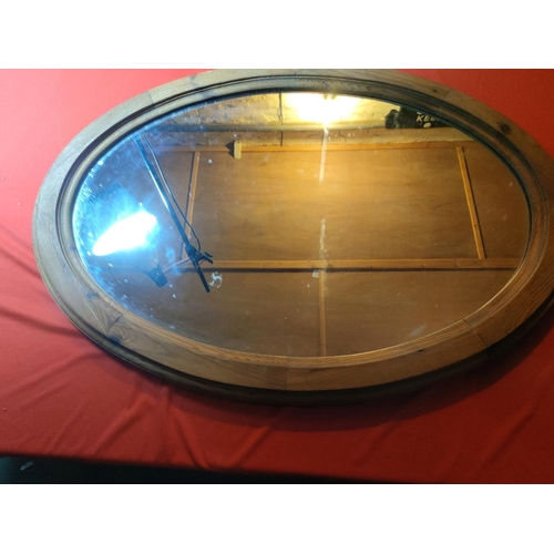 1136 - Large oval mirror, pine surround