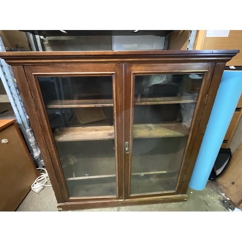 1459 - Wooden bookcase with glass doors. Dimensions are H110cm, W107cm D30cm