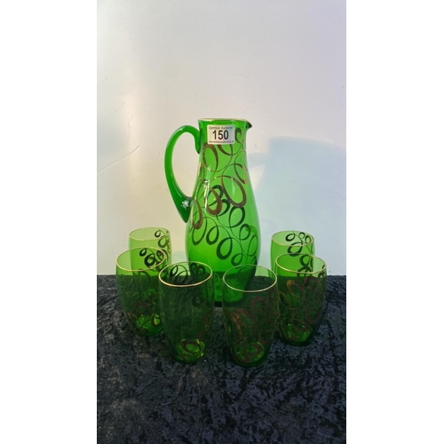 150 - Retro green glass jugs with tumblers with swirly gold design