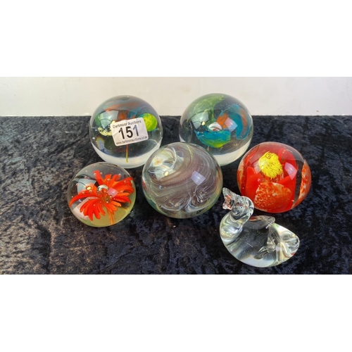 151 - A collection of 6 decorative glass paperweights