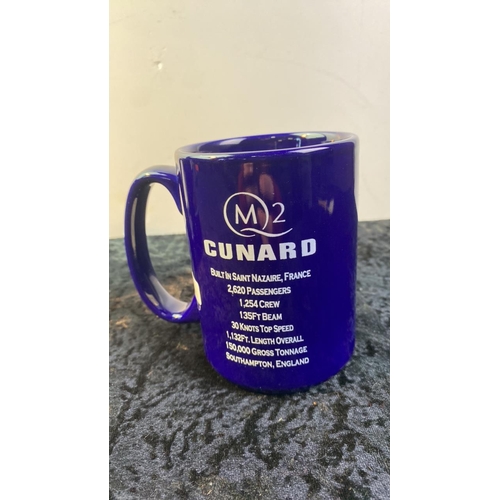 162 - A pair of Cunard QM2 mugs with gold ship design