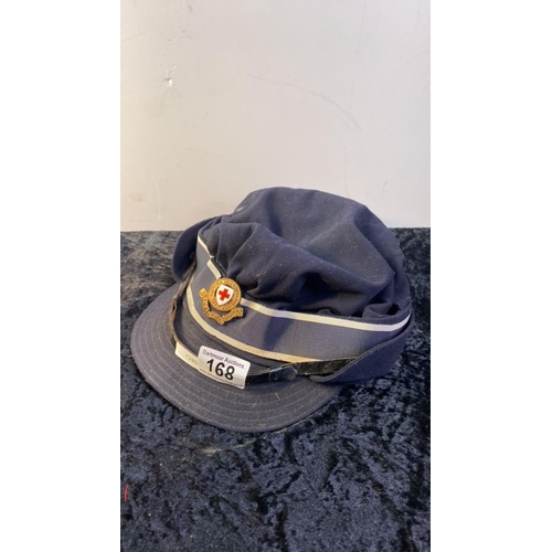 168 - A vintage Scott and Co uniform hat with British Red Cross cap badge