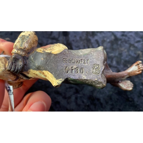 49 - A pair of bronze sculptures of children lying down signed B, possibly Bergman on the base - Measures... 