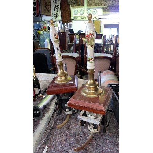 709 - Two hand beer pumps with hunting designs on handles