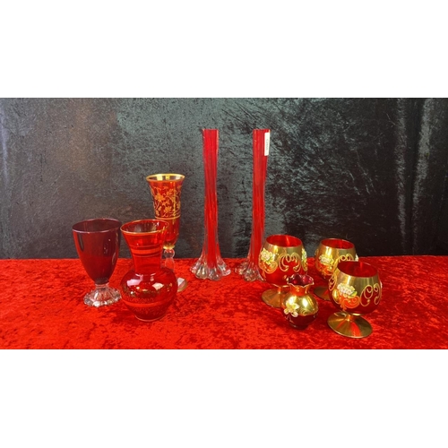 155 - Collection of red art glass including elephant foot twisted stem vases, Bohemuan style brandy glasse... 