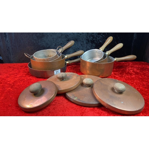 21 - 7 copper pans with 4 lids