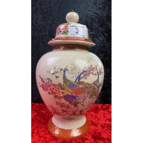 3 - Japanese satsuma lidded urn with peacock design and crazed glazing. Approx 29cm tall