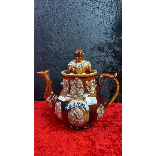 9 - Large highly decorative bargeware teapot approx 30 cm tall - repair to lid rim 