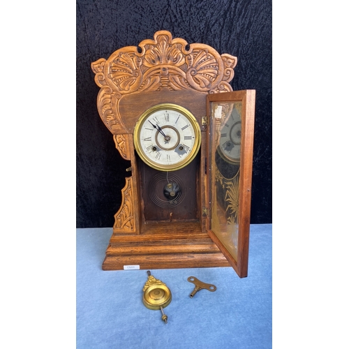 1 - American New Haven Clock Company free standing or wall mounted clock in elaborately carved case and ... 