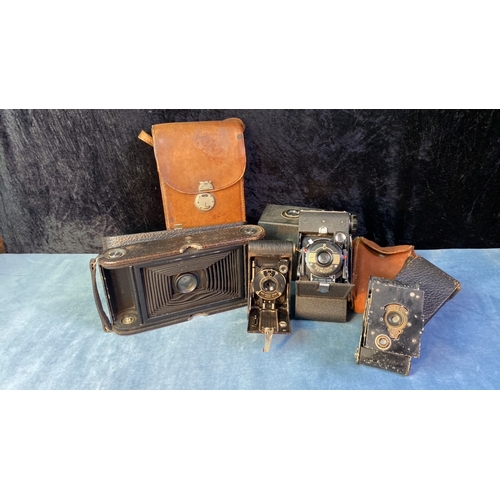 121 - Kodak No.3-A folding pocket camera model B-5 in leather case, a Kershaw Eight-20 Penguin camera in f... 