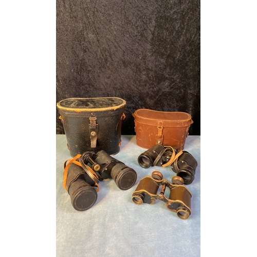 124 - Three pairs of binoculars - Optomax 10 x 50 in case, vintage metal pair and Ross London 9 x 35 in ca... 