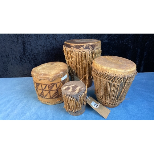 14 - Four genuine African ethnic skin drums of some age