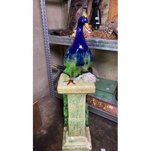 23a - Very impressive Majolica statue of a peacock on plinth with trailing tail. Some damage to base of pl... 