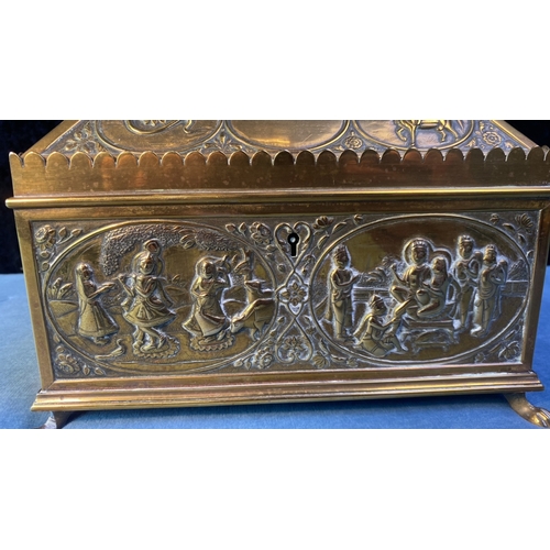 41 - Ornate brass lidded urn / tea chest with Eastern, possibly Indian design incl. musicians, kings/deit... 