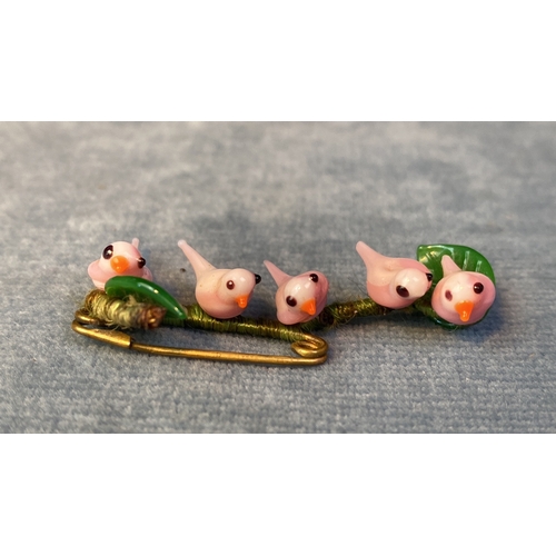 591 - The prettiest pin broach featuring five glass pink birds. Teeny damage to very end of two tails