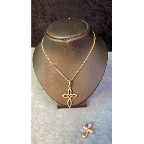 597 - Two lovely, unusual silver cross pendants and chain