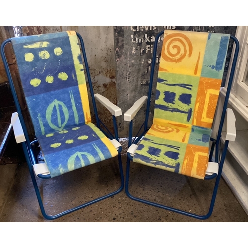 953 - Pair of lightweight padded deck chairs