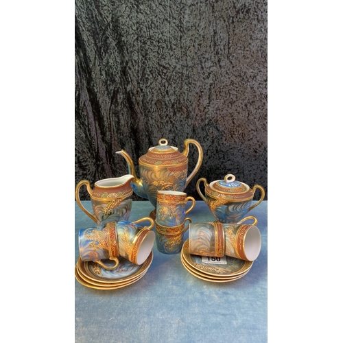 150 - Beautiful Oriental tea/coffee set decorated with a most gorgeous raised dragon design