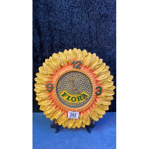 292 - Flora advertising wall-hanging clock in the form of a pretty sunflower, battery operated, approx 30c... 