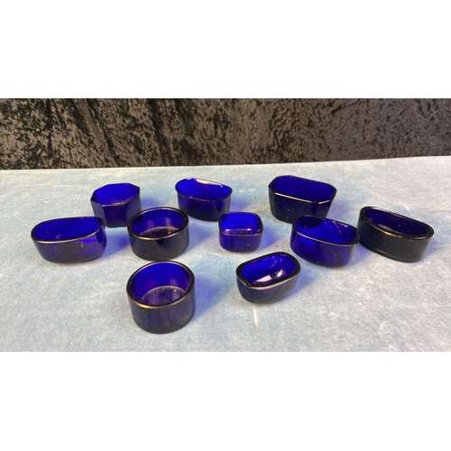 294 - A collection of blue glass liners, 10 total