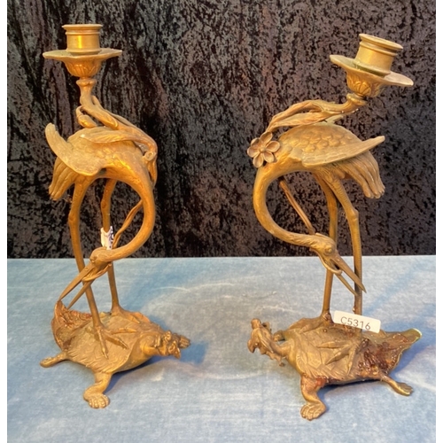 39 - Pair of brass crane on dragon turtle with lotus flower candlesticks (one a/f), approx 32cm tall