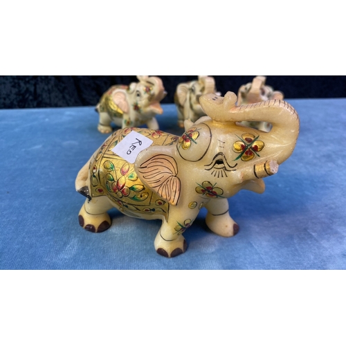 403 - Four Oriental, decorated, marble elephants